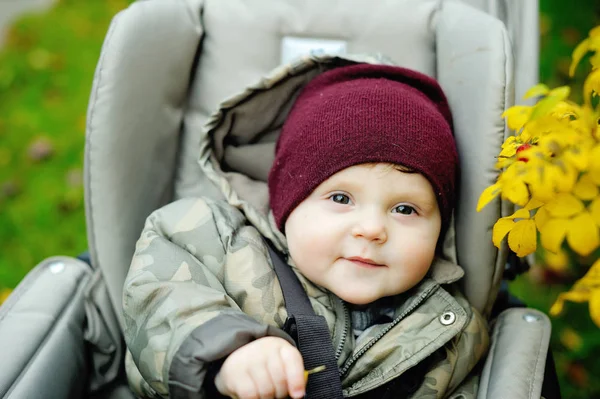 Baby boy in warm in modern stroller — ストック写真