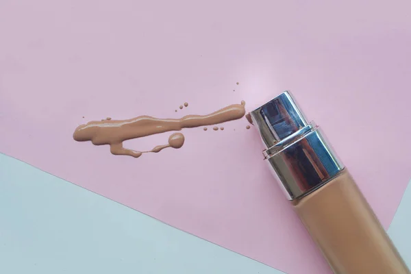 Light beige makeup liquid foundation isolated on