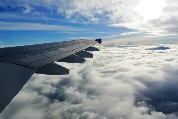 Aerial view Clouds and sky as seen through window of an aircraft — Stock Photo, Image