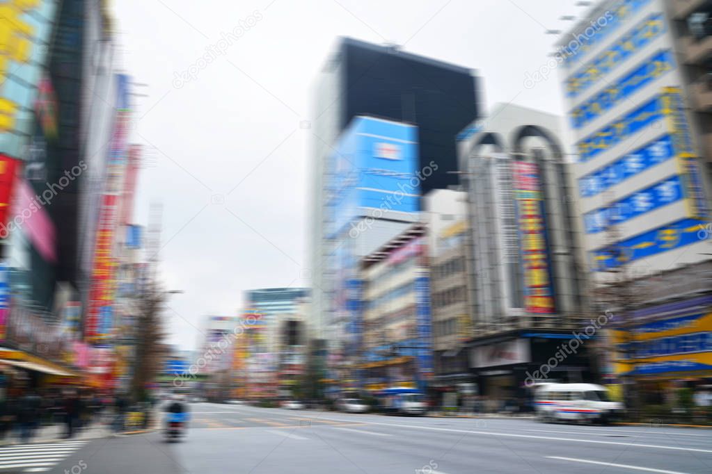 Abstract blur people crosswalk around Akihabara district area in