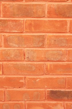 Arka plan tasarım öğesi bir closeup kırmızı tuğla ve harç duvar.