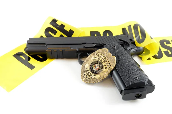 Police Badge Gun Caution Tape Securing Area — Stock Photo, Image