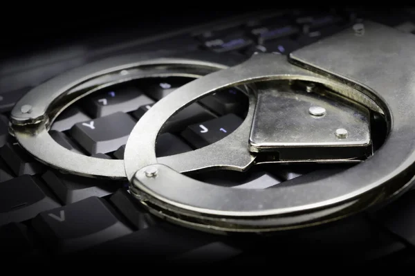 Conceptual Image Steel Law Enforcement Handcuffs Placed Top Dark Keypad — 图库照片