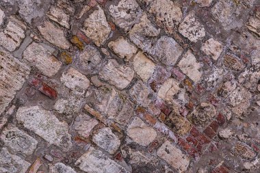 bej gri birçok taşları eğik cobblestones eski yıpranmış arka plan tabanının sonsuz satır tuval