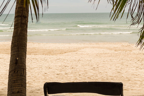 background vacation tropical island shallow yellow sand ocean shore endless water with shallow waves