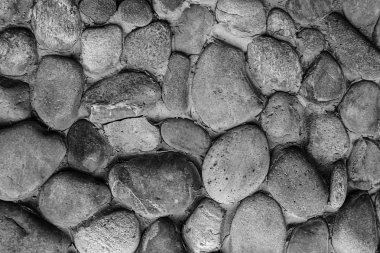 Cobblestones oval gri tonlama tek renkli kentsel modeli düzensiz birçok kömür topakları arka plan gri.
