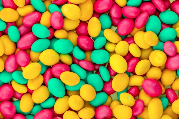Sárga zöld cukorka mázas rózsaszín fényes minta alap ünnepi gyermekkori web design — Stock Fotó