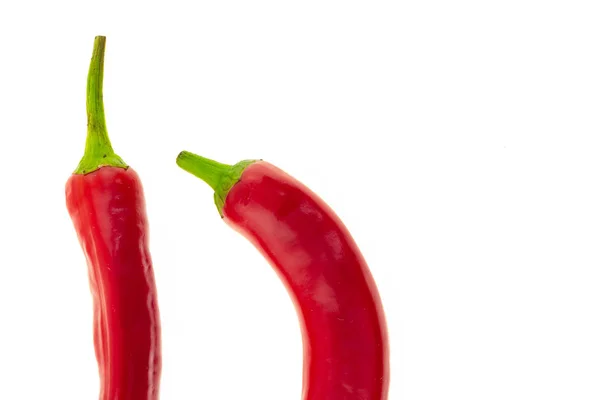 Chili pepper red part of a pod straight curved on a white background design culinary base — Stock Photo, Image