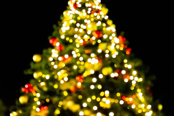 high christmas tree bright garland golden blurred colorful night celebration