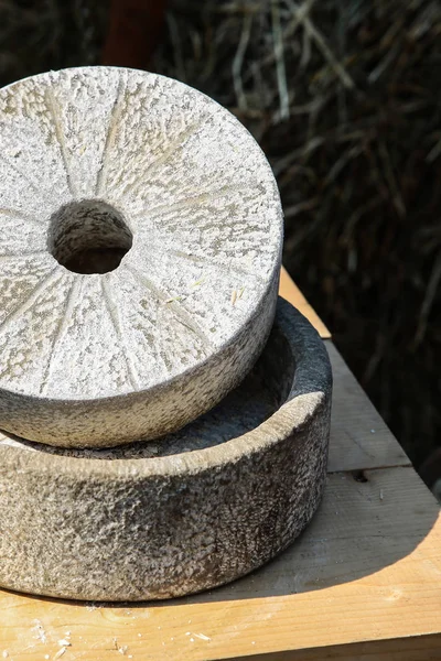 traditional stone mill flour production grinding wheat rye gray cobblestone close-up