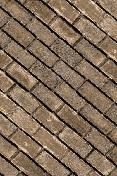 Cobble kő falfestmények sok barna szürke ferde városi design háttér bázis — Stock Fotó
