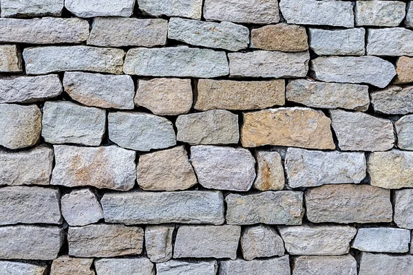 Grijze steen ongelijk verweerde oude kasseien natuurlijke achtergrond — Stockfoto