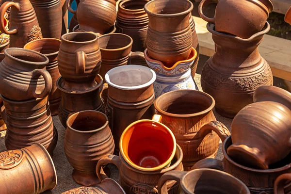 Kraft mug clay natural material many potter's counter traditional dishes — Stock Photo, Image