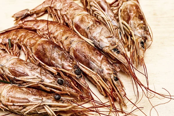 king prawn big lies on a wooden cutting board preparation for cooking
