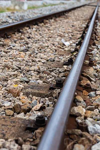 Iron rail closeup gravel. Railway track connects cities