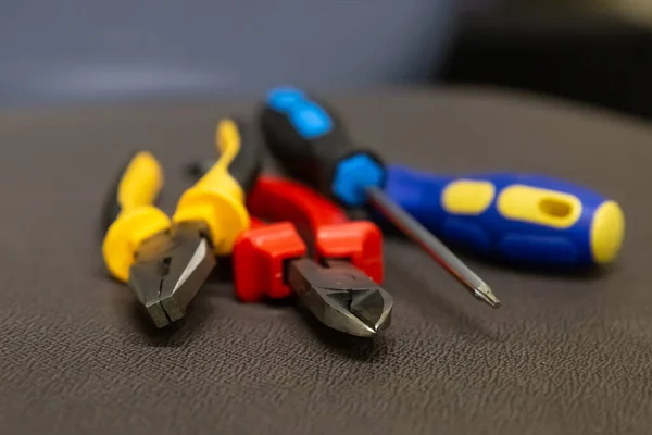 Yellow Pliers Tool Set Red Nippers Two Blue Screwdrivers — Stock Photo, Image