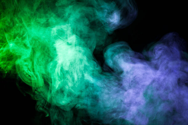 Blue and green smoke on black backgroun