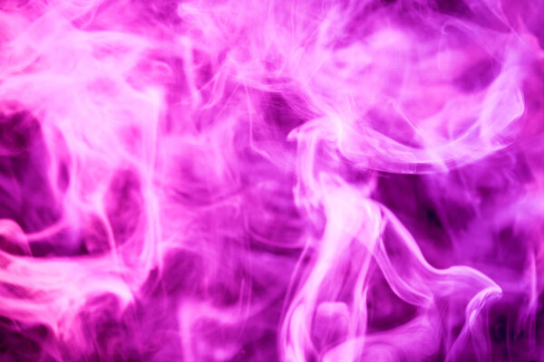 Dense pink smoke on a black isolated background. Background of smoke vape