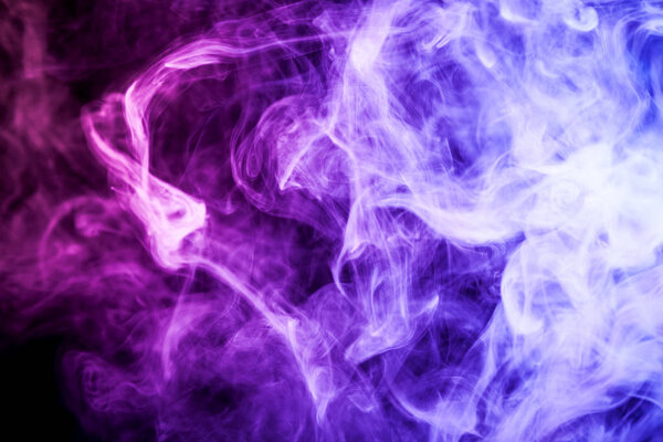 Thick purple smoke on a black isolated background. Background from the smoke of vap