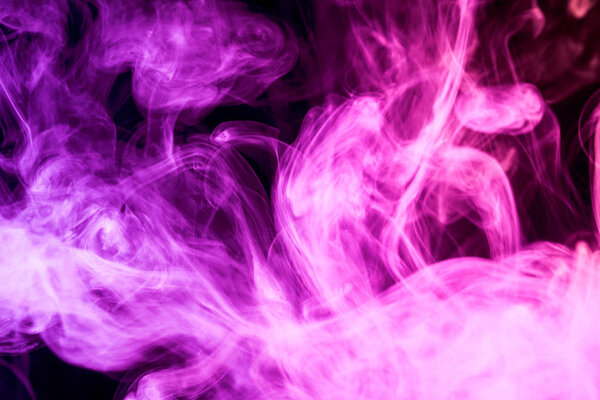 Cloud of purple smoke on a black isolated background. Background from the smoke of vap