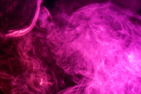 Cloud of pink smoke on a black isolated background. Background from the smoke of vap