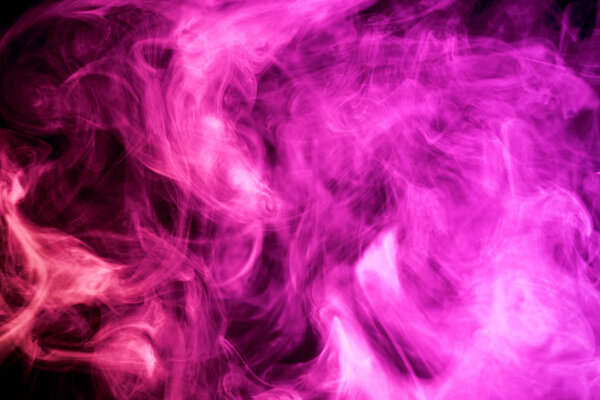 Thick colorful pink smoke on a black isolated background. Background from the smoke of vap