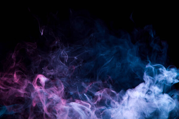 Thickpink and purple smoke on a black isolated background. Background from the smoke of vap