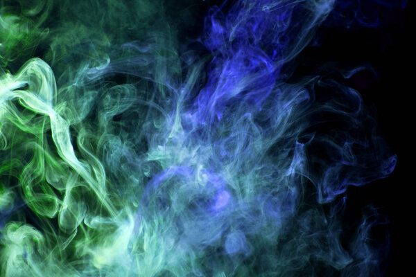 Cloud of green and blue smoke on a black isolated background. Background from the smoke of vap