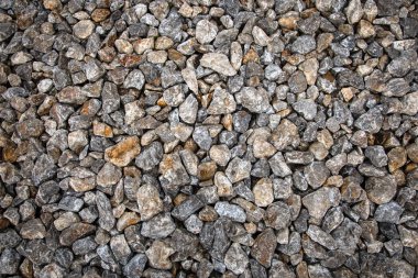 Eski şehirde zeminde farklı boyutlarda gri taşların yakın çekim, arka plan