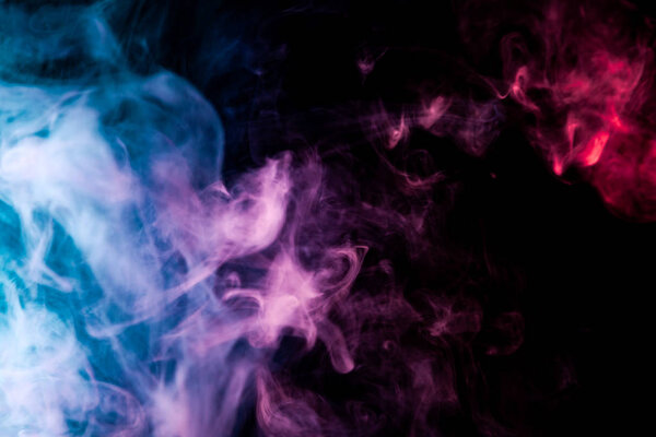 Pink, purple and blue cloud smoke on black isolated backgroun