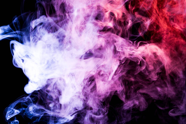 Purple, pink and blue smoke on black backgroun