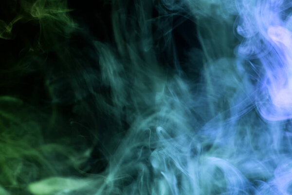 Blue and green  cloud smoke on black  isolated backgroun