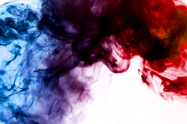 Blue and red  smoke on white backgroun