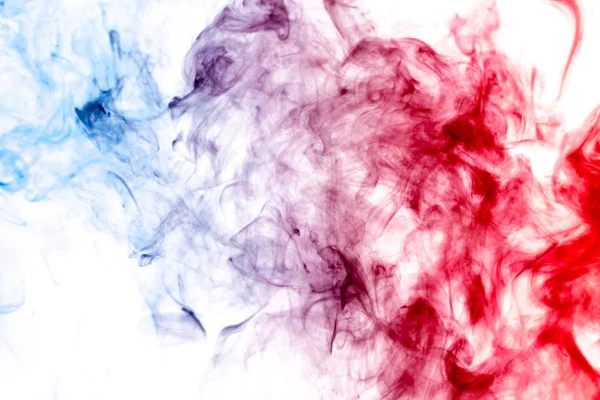Thick red,blue smoke on a white isolated background. Background from the smoke of vap