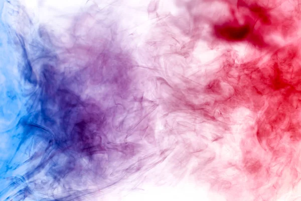 Cloud of red and blue smoke on a black isolated background. Background from the smoke of vap