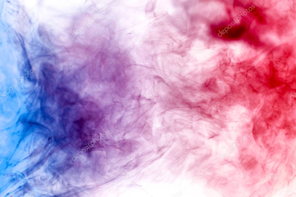 Cloud of red and blue smoke on a black isolated background. Background from the smoke of vap