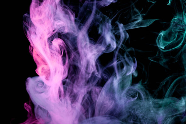 Blue, purple and pink smoke on black backgroun