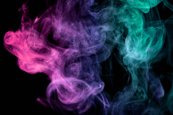 Pink, green and blue cloud smoke on black isolated backgroun
