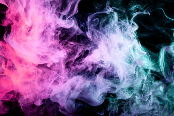 Pink, green and blue cloud smoke on black isolated background