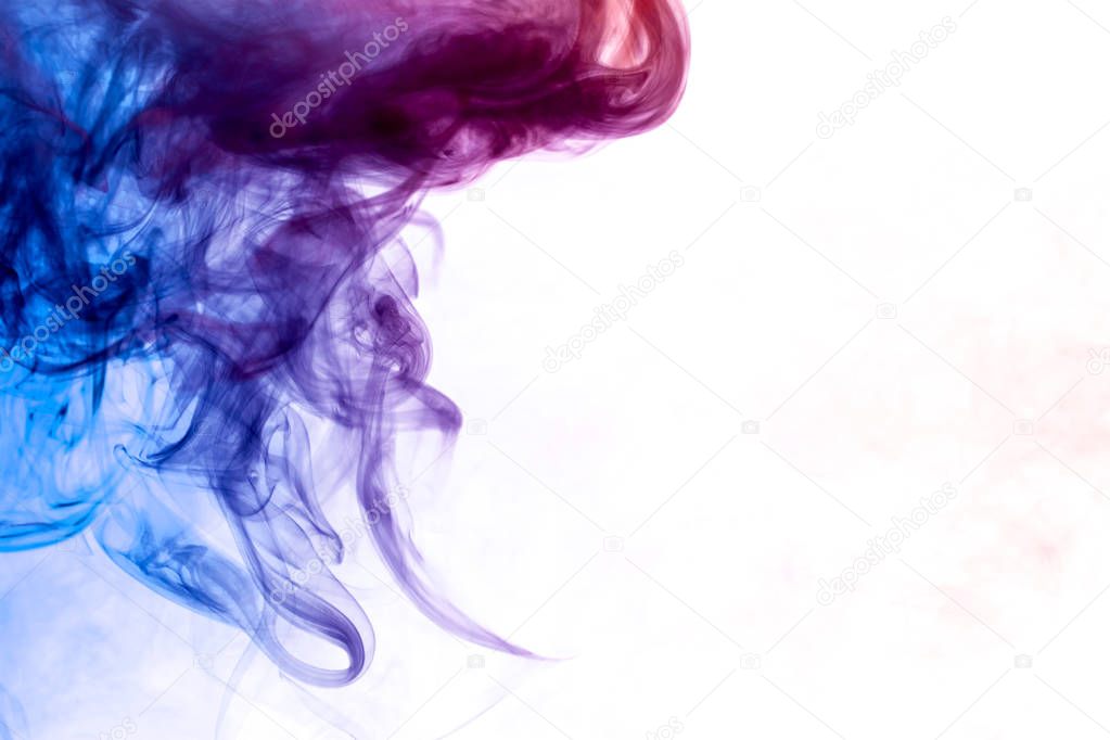 Blue, purple and pink  smoke on white backgroun