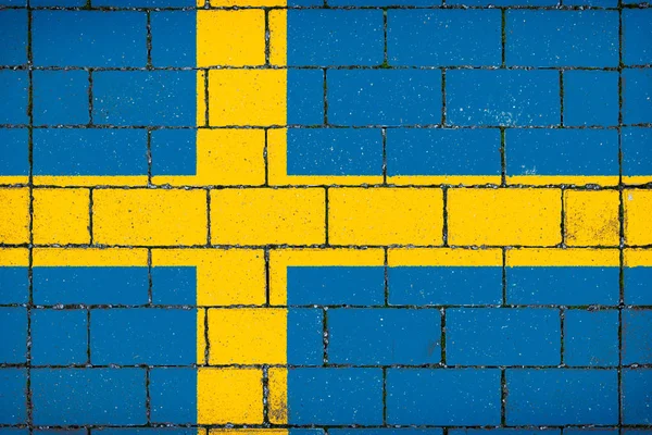 Nationale Vlag Van Zweden Tegen Een Achtergrond Van Een Stenen — Stockfoto