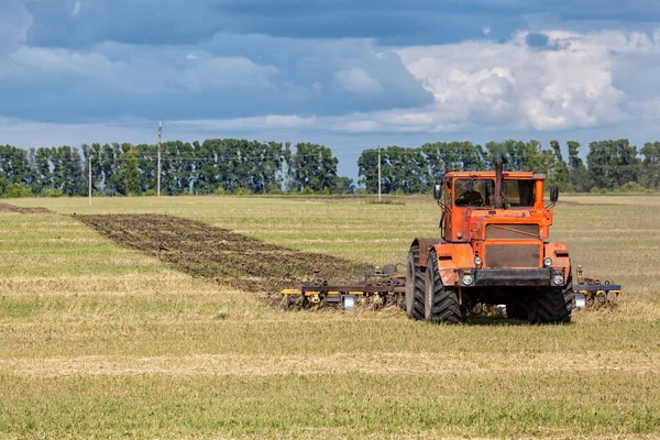 Orange Modern Tractor Plows Earth — Stock Photo, Image