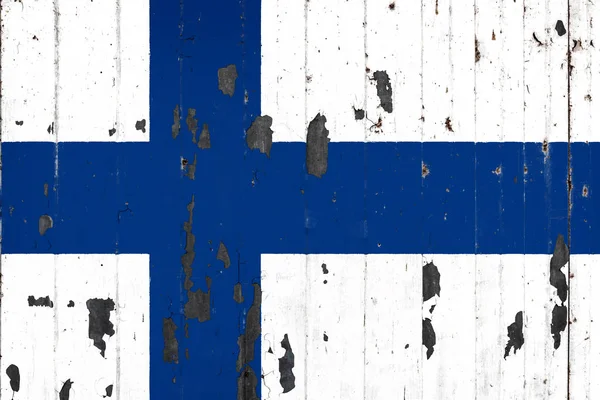 Mettale の背景にフィンランドの国旗がペイントを剥離で覆われて — ストック写真