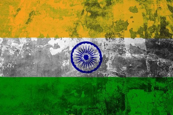 National flag of India on the background of the old wall covered with peeling paint