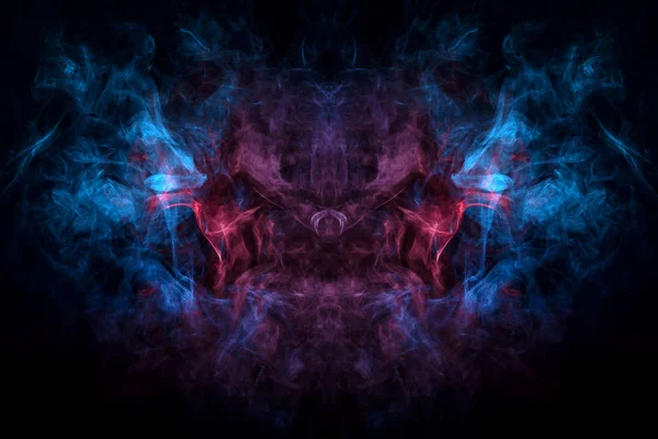 Mocap for cool t-shirts. Dense multicolored smoke of   blue and purple colors in the form of a skull, monster, dragon on a black isolated background. Background of smoke vape.