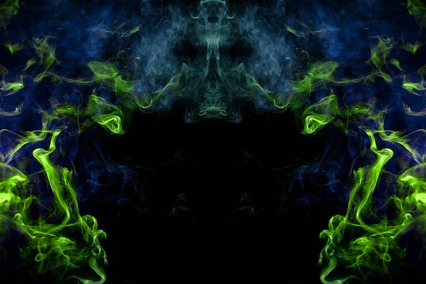 Fantasy print for clothes: t-shirts, sweatshirts. Blue and green cloud of smoke in the form of a monster  of  black isolated background. Background from the smoke of vape