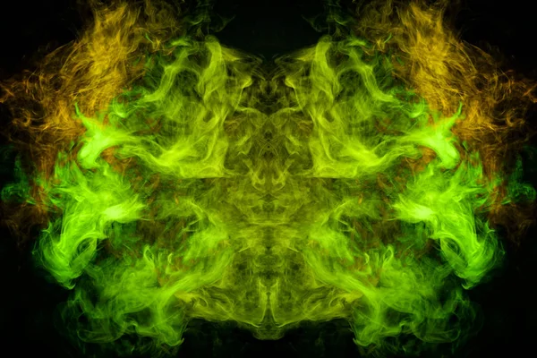 Fantasy print for clothes: t-shirts, sweatshirts. Green and yellow cloud of smoke in the form of a monster  of  black isolated background. Background from the smoke of vape