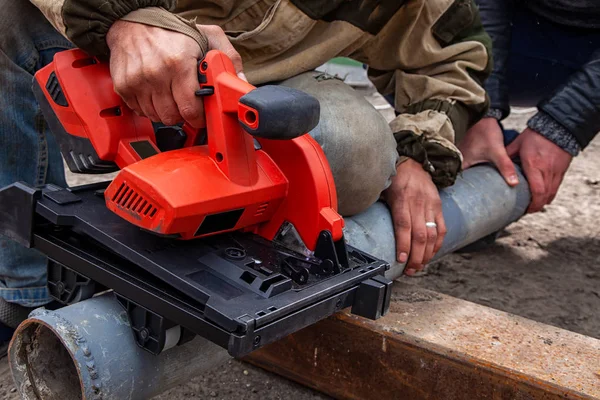 Close Man Builder Sawing Metal Hand Modern Red Circular Saw — Stock Photo, Image