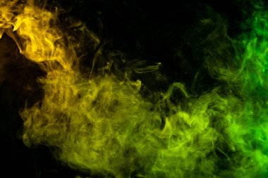Yaratıcılık için dokusal arka plan. Renkli yeşil ve sarı siyah bir duman arka plan izole. Vap duman arka plan
