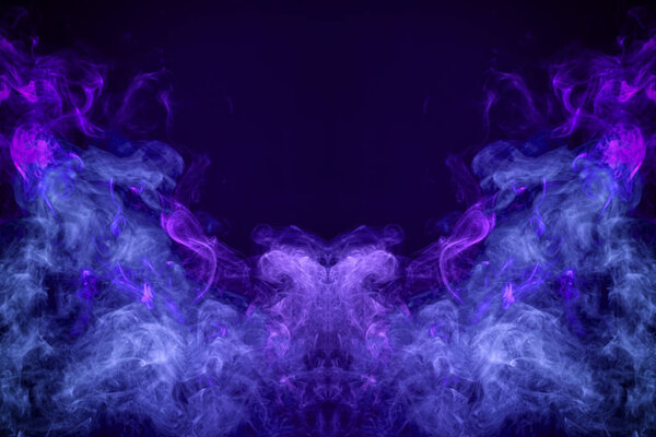 Fantasy print for clothes: t-shirts, sweatshirts. Thick colorful smoke of purple, blue colors smoke in the form of a skull, monster, dragon on a black isolated background. Background from the smoke of vap